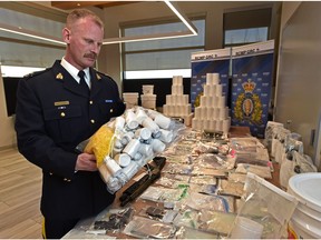 Inspector Mike Lokken, officer-in-charge of Parkland RCMP, shows off a large drug seizure made in Parkland County, Thursday, April 29, 2021.