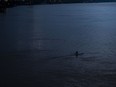 A person kayaks through the Parana River in Rosario, Argentina, on April 23
