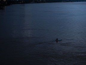 A person kayaks through the Parana River in Rosario, Argentina, on April 23