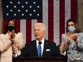 U.S. President Joe Biden addresses a joint session of Congress as President Kamala Harris and Speaker of the House U.S. Rep. Nancy Pelosi react in the U.S. Capitol in Washington, DC, April 28, 2021.