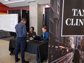 Since 2010, students in the MacEwan University Accounting Club have been holding annual tax clinics to prepare and file taxes for their fellow students and members of the community, including many recent immigrants and refugees. (Photo taken before COVID-19.)