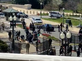 In this video screengrab, two stretchers can be seen being brought out to tend to two officers in the U.S. Capitol complex.