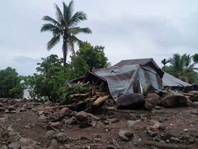 Damaged homes are seen after a flash flood in Lembata, East Flores, on April 5, 2021 as torrential rains triggered floods and landslides that have killed at least 91 people and left dozens missing in Indonesia and neighbouring East Timor. (Photo by HANDRIANUS EMANUEL / AFP)