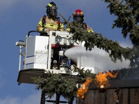 Firefighters battle a large fire at the Castle Court apartments, 14407 121 St., in Edmonton, Thursday, April 8, 2021.