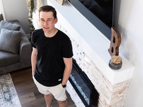 Ty Bettac poses for a photo at his home in Fort Saskatchewan on Friday, April 16, 2021. Bettac is a testicular cancer survivor who's sharing his story and reminding other of the importance to get checked as a part of April's Testicular Cancer Awareness Month. Photo by Ian Kucerak