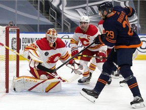 The Edmonton Oilers' Leon Draisaitl (29) is stopped by Calgary Flames' goalie Jacob Markstrom (25) during first period NHL action at Rogers Place, in Edmonton Thursday April 29, 2021.