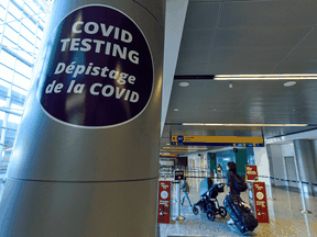 Arriving international travellers head to the COVID testing area at Calgary International Airport on Friday, Jan. 8, 2021.