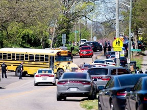 Police attend a shooting at Austin-East Magnet High School in Knoxville, Tennessee, U.S. April 12, 2021.