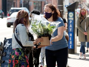 Edmontonian's line up to purchase Mother's Day flowers at Laurel's On Whyte, 8210 104 St., in Edmonton Sunday May 9, 2021. Photo by David Bloom