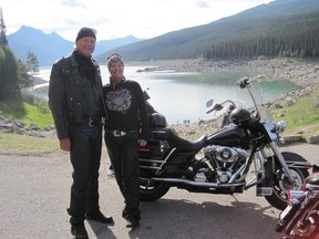 Global TV anchor and producer Gord Steinke and his wife Deb have enjoyed motorbike trips in the Rockies during the COVID-19 pandemic and are pictured here taking a break at the north end of Jasper's Medicine Lake. When the going is safe, the couple plan to trace family roots in England before visiting First World One French battle sites where Steinke' grandfather fought.