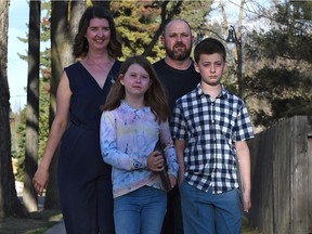 Katie Heidt, seen with her husband and their two kids on Wednesday, May 5, 2021. Heidt said she’s concerned about the toll the back-and-forth from in-person to online learning is taking on her kids.
