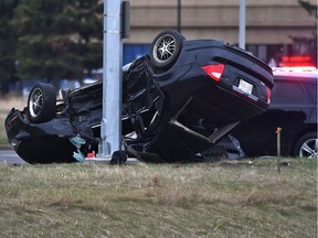 One vehicle rolled over into a light standard during a two-vehicle collision on the 91 Street overpass at Whitemud Drive in Edmonton on Friday, May 7, 2021.