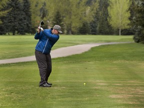 Tyson Joyce golfs by himself at the Victoria Golf Course on Thursday, May 20, 2021 in Edmonton.