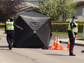 Police investigate a fatal pedestrian collision at 129 Avenue and 126 Street on Friday, May 21, 2021 in Edmonton.