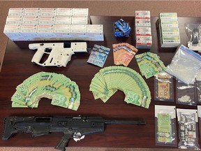 Spirit River RCMP seized a loaded 12 gauge shotgun, loaded magazines, sawed-off rifle, a gun case, approximately $21,000 in Canadian Currency and a quantity of pills believed to be steroids, following a search of a vehicle in a remote area near Township Road 775A in Saddle Hills County, Alta., on May 18, 2021.