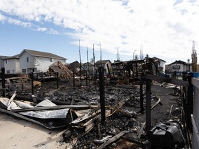 Three homes destroyed at 85 Street and 179 Avenue on Friday, May 28, 2021, are left in a pile of rubble on Saturday, May 29, 2021.
