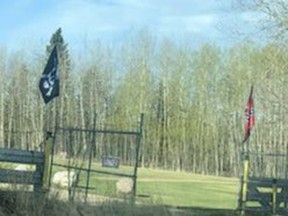 The Brazeau County property where a Hitler Youth flag was reported May 11. As of 8:30 a.m. on May 13, the Nazi banner had been removed and replaced with a pirate flag. A Confederate flag remained on the adjacent pole. Image supplied