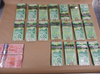 Cash seized during a drug bust. Edmonton police’s drug and gang enforcement unit laid 87 charges against eight people during three separate drug-trafficking investigations that wrapped up in May 2021. supplied