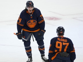 Edmonton Oilers defenceman Ethan Bear (74) celebrates his goal with teammate Connor McDavid (97) against the Montreal Canadiens on April 19, 2021, in Edmonton.