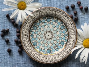 Slip-trailed, hand-painted dessert plates by Tanya Everard.