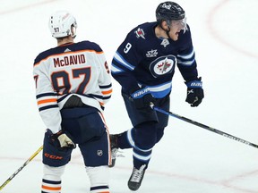 Winnipeg Jets forward Andrew Copp (right) celebrates the tying goal from Josh Morrissey against the Edmonton Oilers in Game 3 of a Stanley Cup playoff series in Winnipeg on Sun., May 23, 2021.
