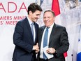 Prime minister of Canada Justin Trudeau (L) with premier of Quebec François Legault (R) shake hands during a meeting with Canadian prime ministers in Montreal, on December 7, 2018 at the Marriott Chateau Champlain.