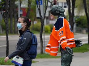 A statue at the University of Alberta Campus was draped with an Edmonton Oilers hockey jersey on Monday May 24, 2021, appearing to be looking for divine intervention. (Photo by Larry Wong/Postmedia)