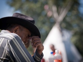 File photo: JUNE 30, 2010 -- Harry Joseph Cardinal, 84, from Good Fish Lake, Alta. pauses during a ceremony to remember the children from First Nations and Métis communities who were students at the Red Deer Industrial School (1893-1919) in Red Deer, Alta. on June 30, 2010. Cardinal's mother Flora Bird attended the residential school which was operated by the Methodist Church (now the United Church of Canada) and the federal government. (Ryan Jackson / Edmonton Journal).