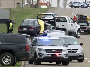 Police and emergency work at the scene of a fatal shooting along Baseline Road between Hwy. 21 and Clover Bar Road, in Sherwood Park Friday May 7, 2021. A 43-year-old man is facing a charge of murder.