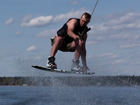 Shane Bunnin takes advantage of the warm weather at Pigeon Lake to get in the first wakeboard of the season on Sunday, May 16, 2021 . Even thought the air temperature was a balmy 23 C the water temperature was only 2 C. Greg Southam-Postmedia