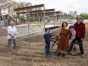 Co-housing community members (from left) Della Dennis, Max Moss, 9, Thea Moss, August Moss, 6, and Grant Stovel outside their under-construction Urban Green cohousing building at 10115 88 Ave.