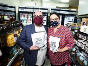 Chris Lerohl and Ray Mah (a married couple) with some of their products in their Uproot Food Collective facility.

The have created a partnership between the collective and the Edmonton International Airport to build a federally certified food production facility and packing facility in an old airline prep kitchen at the airport. Uproot represents Honest Dumplings, South Island Pies and Natural Kitchen Delights. But it was the Honest Dumplings proprietors, Chris Lerohl and Ray Mah (a married couple) who began the whole operation with their dumpling company nearly 10 years ago. Taken on Tuesday, June 15, 2021 in Edmonton.  Greg Southam-Postmedia