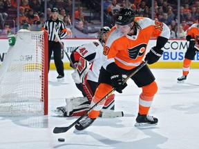 Nolan Patrick (No. 19) of the Philadelphia Flyers tries to get a shot off on Craig Anderson #41 of the Ottawa Senators in the second period at Wells Fargo Center on March 11, 2019 in Philadelphia, Pennsylvania.