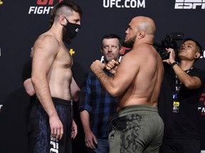 Tanner Boser of Canada and Ilir Latifi of Sweden face off during the UFC Fight Night weigh-in at UFC APEX on June 04, 2021 in Las Vegas, Nevada.