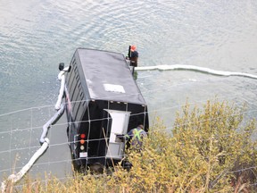 One person died after a tour bus drove through the parking area Castle Mountain Lookout, just off of the westbound lane of the Trans-Canada Highway in Banff National Park, and landed in the Bow River on the morning of Wednesday, September, 21, 2016. Amanda Symynuk/ Crag & Canyon/ Postmedia Network