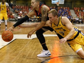 Edmonton Stingers forward Jordan Baker (8) battles Fraser Valley Bandits' Joel Friesen (11) during a CEBL game at Northlands Expo Centre in Edmonton, on Aug. 1, 2019.