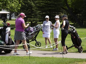 A foursome of golfers golfs at Victoria Golf Course on Tuesday, June 1, 2021 in Edmonton. Four people from different household are now allowed to golf together as the province eases COVID-19 restrictions today. Greg Southam-Postmedia