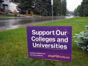 A lawn sign opposing cuts to post secondary education funding on 119 Street near 78 Avenue in Edmonton on June 10, 2021.