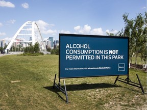 A sign near the Walterdale bridge warns that alcohol consumption is not permitted in this area after more than 30 tickets have been issued for illegal public alcohol consumption during the first month of the city's pilot project.