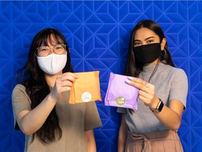 Anka Chan (left) and Nicole Sanchez with Ruth show their company's sustainable Ruth Pads at their office in Edmonton, on Thursday, June 24, 2021. Ruth menstrual pads are made from natural materials including kenaf fibre, wood pulp, and a corn-based waterproof backing layer.