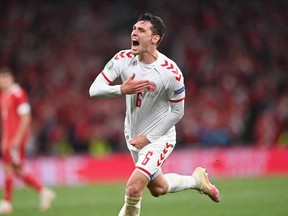 Denmark's defender Andreas Christensen celebrates after scoring his team's third goal during the UEFA EURO 2020 Group B football match between Russia and Denmark at Parken Stadium in Copenhagen on June 21, 2021.