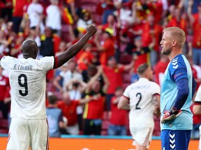 Belgium players Romelu Lukaku (No. 9) and Toby Alderweireld (No. 2) celebrate their second goal as Denmark goalkeeper Kasper Schmeichel looks on at the Euro 2020 at the Parken Stadium in Copenhagen, Denmark on June 17, 2021.