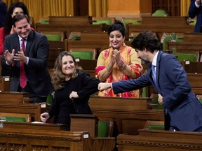 Finance Minister Chrystia Freeland receives a fist-bump from Prime Minister Justin Trudeau after unveiling her first fiscal update, the Fall Economic Statement 2020, in the House of Commons, in Ottawa, on Nov. 30.