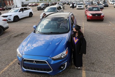 A student waits for their turn to receive their diploma during Archbishop MacDonald High School's drive-in graduation ceremony, at the Edmonton EXPO Centre parking lot Friday June 4, 2021. The unorthodox ceremony was in response to COVID-19 health restrictions.