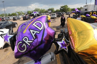 Students and their families take part in Archbishop MacDonald High School's drive-in graduation ceremony, at the Edmonton EXPO Centre parking lot Friday June 4, 2021. The unorthodox ceremony was in response to COVID-19 health restrictions.