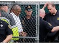 Actor and comedian Bill Cosby leaves the Montgomery County Courthouse in handcuffs after sentencing in his sexual assault trial in Norristown, Pennsylvania, U.S., September 25, 2018.