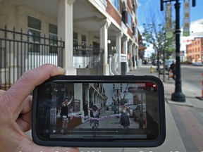 Pride is doing an augmented reality celebration this year for its 10 locations using QR codes that, when scanned, bring up virtual performers and presenters in that particular location like here outside the Excelsior Lofts in downtown Edmonton.