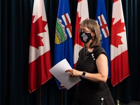 Dr. Deena Hinshaw, Alberta's chief medical officer of health, leaves after a COVID-19 pandemic press conference at the media room at the Alberta legislature in Edmonton on July 28, 2021.