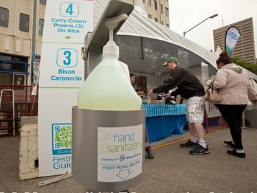 A bottle of hand sanitizer is visible outside booths during the opening day of Taste of Edmonton, in Sir Winston Churchill Square Thursday July 22, 2021. Taste of Edmonton runs from July 22 to August 1. Photo by David Bloom