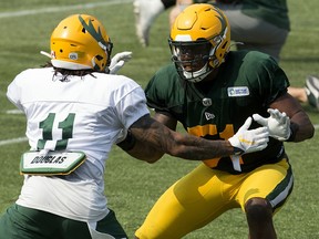 Shai Ross (11) battles Nyles Morgan (51) during Edmonton Elks training camp at Commonwealth Stadium on July 27, 2021.